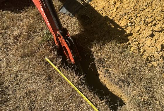 Percolation testing being carried out on site